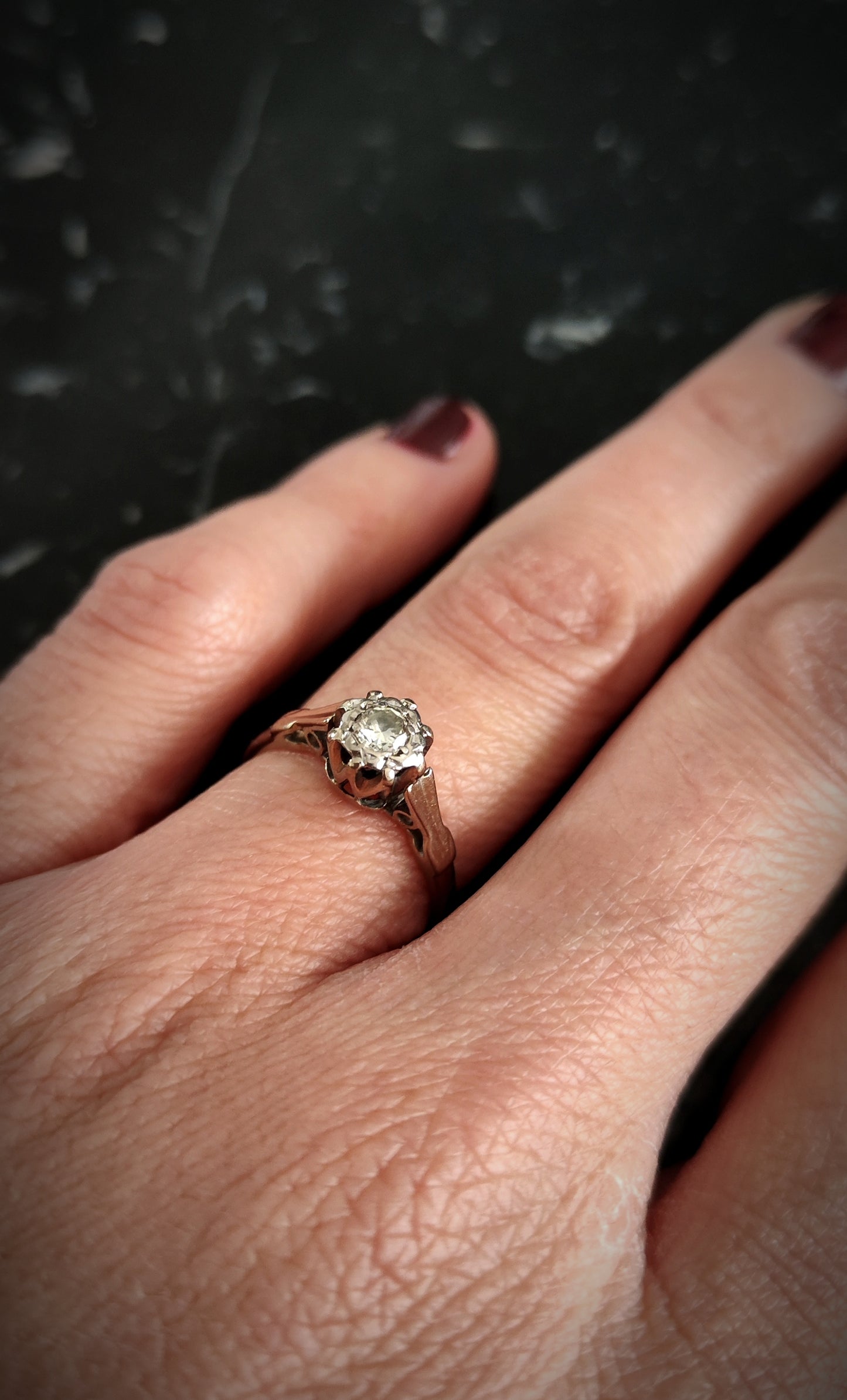 ANTIQUE WHITE AND BRILLIANT GOLD SOLITAIRE.
