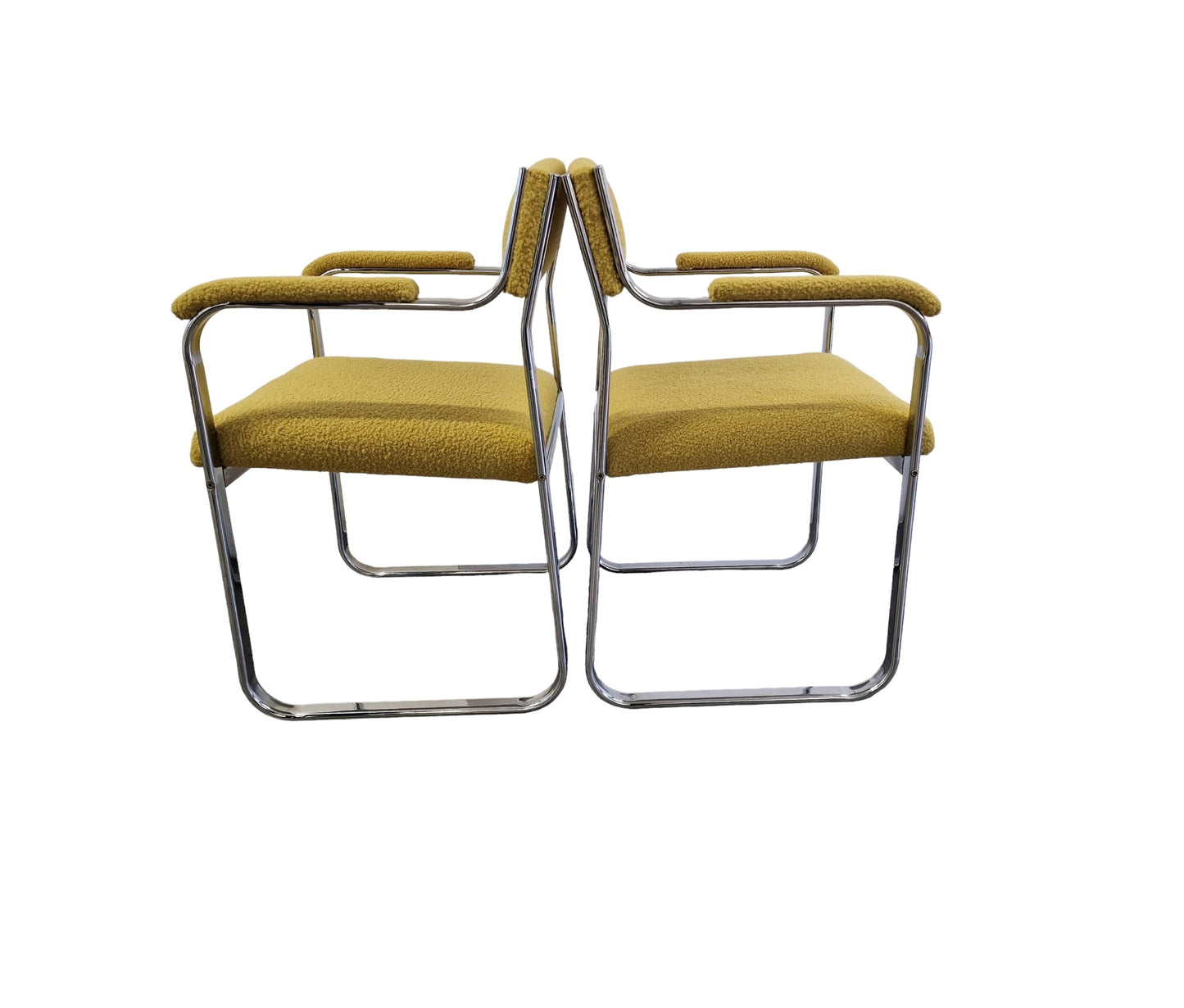 PAIR OF STEEL AND BOUCLE ARMCHAIRS.