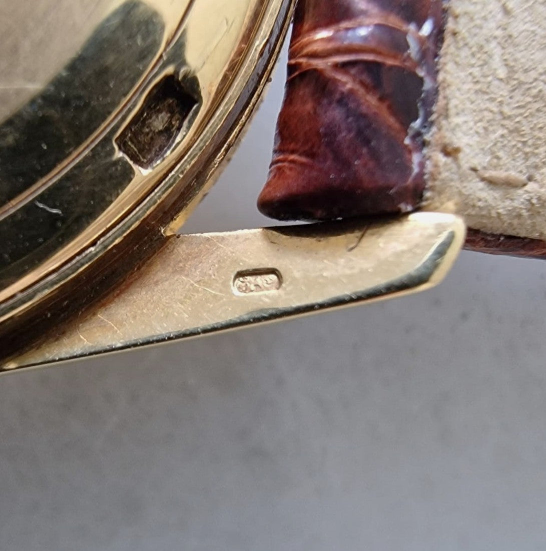 UNIVERSAL GENEVE POLEROUTER DATE ORO 18K